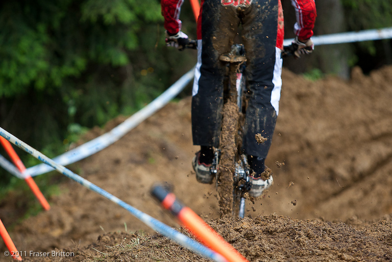 Globs of mud and a slick rear tire are what greeted riders this morning right out of the gate. Minnaar makes the most of it and just tries to make his way down into the next section.