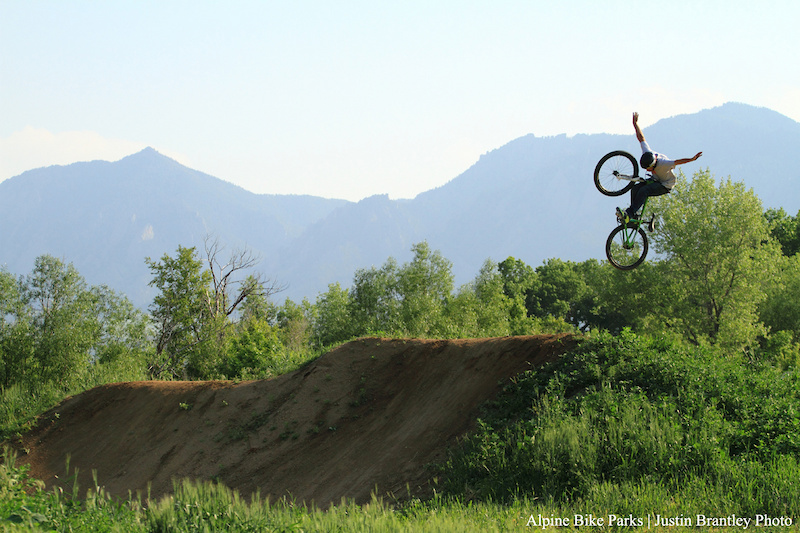 Opening Day at Valmont Bike Park. R-Dogg was throwing down on every run on the new dirt jumps at the end of the day Here he does a nicely extended tuck no hander 