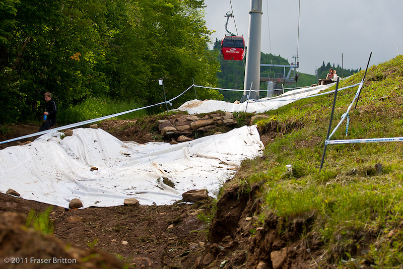Mont Ste Anne World Cup - It rained so hard and the ruts were already so deep that the organizers tarped the berms.