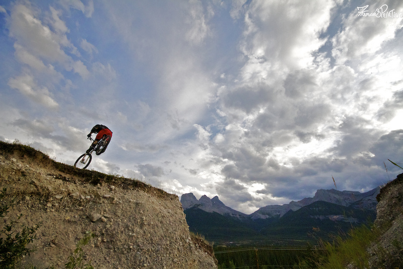 Striving for mediocrity. Piloting the Ellsworth over the washout gap in Canmore. Story at http mtnmanjake.pinkbike.com blog Striving-for-Mediocrity.html