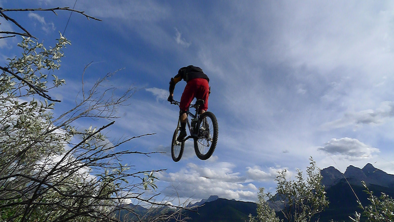 Striving for mediocrity. Piloting the Ellsworth over the washout gap in Canmore. Story at http mtnmanjake.pinkbike.com blog Striving-for-Mediocrity.html