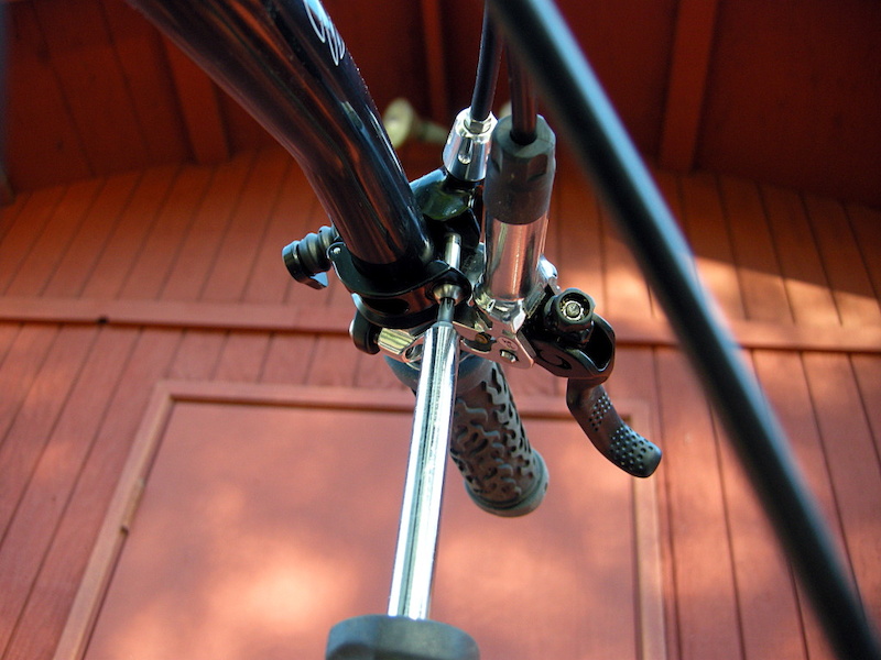Loosen the remote control clamp with a T20 Torx wrench enough so it will slide around the handlebar.
