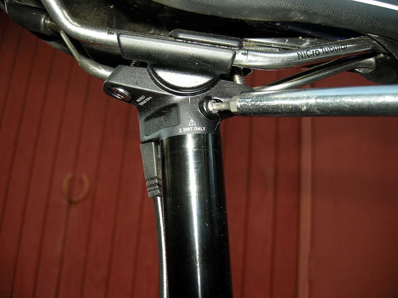 Remove bleed plug from seatpost with a T10 Torx wrench.