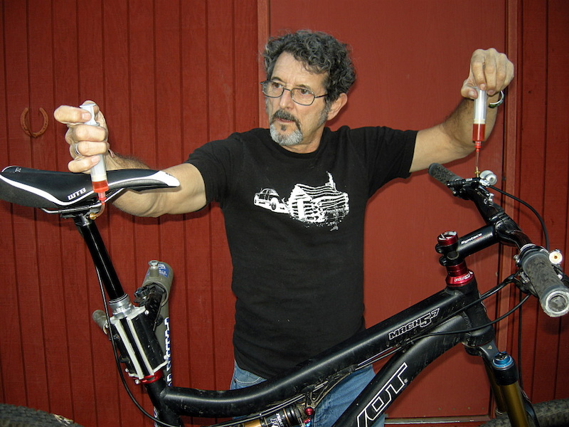 Be sure to keep the syringes upright so the air pockets stay above the fluid stream. Pull a vacuum on the seatpost side while pushing fluid into the remote control side. Watch for bubbles on the vacuum end. When the bubbles stop - or you get down to the last half an inch of fluid on the pressure side stop.
