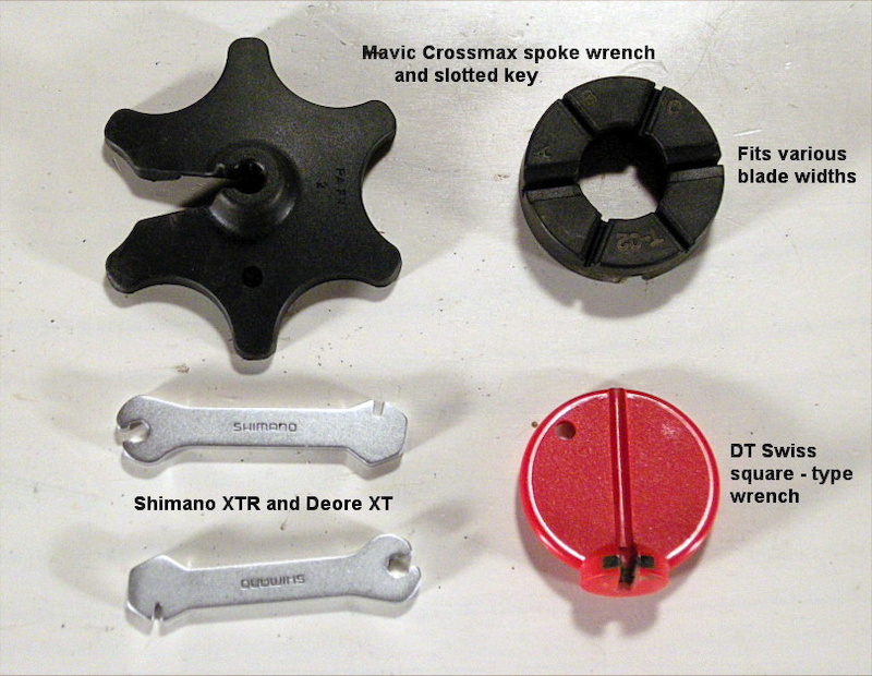 What You ll Need Proper spoke wrench. For standard square nipples choose the type that grabs three corners. Park and DT Swiss make the best. Some spokes use tiny hex nuts and others use splined nipples. - If your wheels have bladed spokes you ll need a second slotted tool that prevents the spoke from twisting as you tension the nipple. - Mavic top and Shimano lower left wheels are shipped with both a slotted and a splined spoke wrench. - Not shown but quite handy is a felt-tip pen to mark the apex of a wobble in the rim that needs straightening.