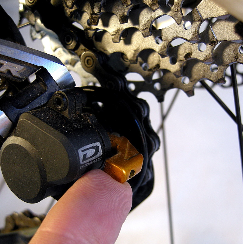 The gold anodized aluminum clutch lever is used to release the friction in order to ease wheel removal. The lever can be set anywhere between closed and open.
