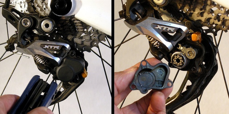 Remove the three clutch-housing screws. They are shoulder screws designed to bottom out on the aluminum derailleur chassis to protect the plastic housing. Put the housing and screws in a clean safe place.