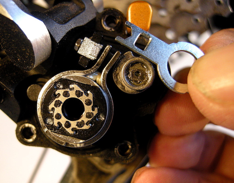 Pull the tiny wrench out from its stowage place.