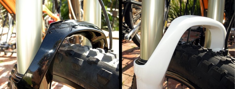 We spotted a new fork crown design left with a wider cross-section that fits closer to the tire and has and a much more robust transition into the slider casting. A rear-swept wing adds stiffness to the top of the new arch. Compare it to the thinner Velvet arch on the right.