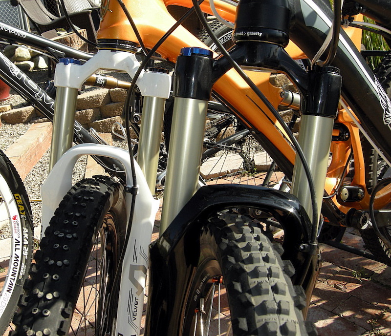 Velvet 32-millimeter fork in the background compared to the larger 34-millimeter stanchion-tube 2013 fork in the right. HOw many changes can you spot