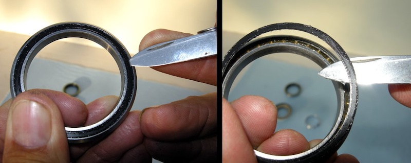 Photo 4 - CAREFULLY find the outer edge of the seal and pry it out of its groove.NEVER touch the inner lip of the seals with a tool.