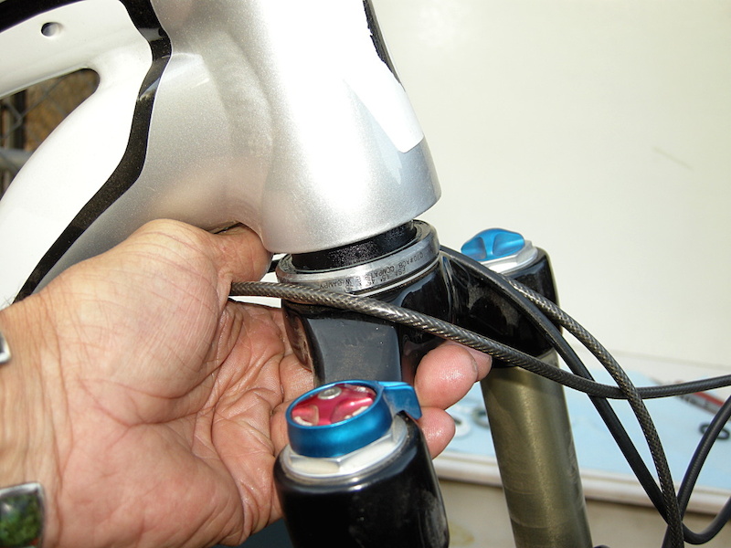 Photo 10. Before you slide the steerer tube into the frame make sure that the brake hoses and shift housings are all headed in the right direction.