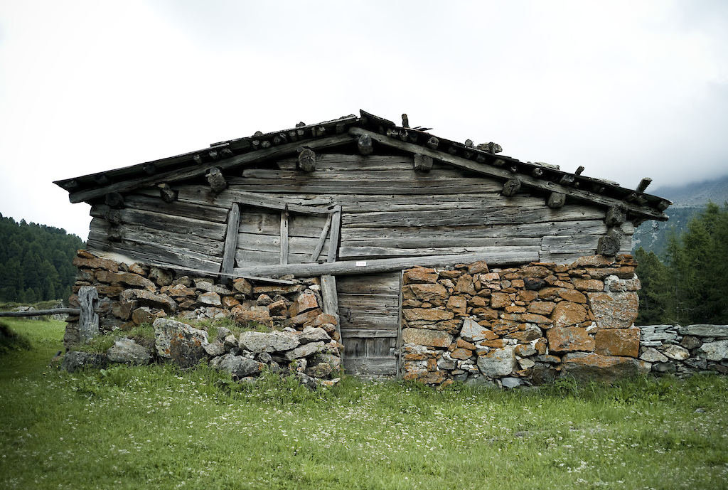 <span style='font-size:12px'>The whole Alta Rezia region is littered with ancient farms, many showing the signs of suffering decades of inclement weather, being buried in metres of snow in the winter.</span><br><br>It's the penultimate day of a four day navigation around 270 miles of the Swiss and Italian Alta Rezia region of the Alps. Self supported, we're carrying the basics for overnight'ing in the villages that dot our map while loosely trying to follow the route pioneered by Hans Rey and Thomas Frischnecht back in 2004, labelled the 