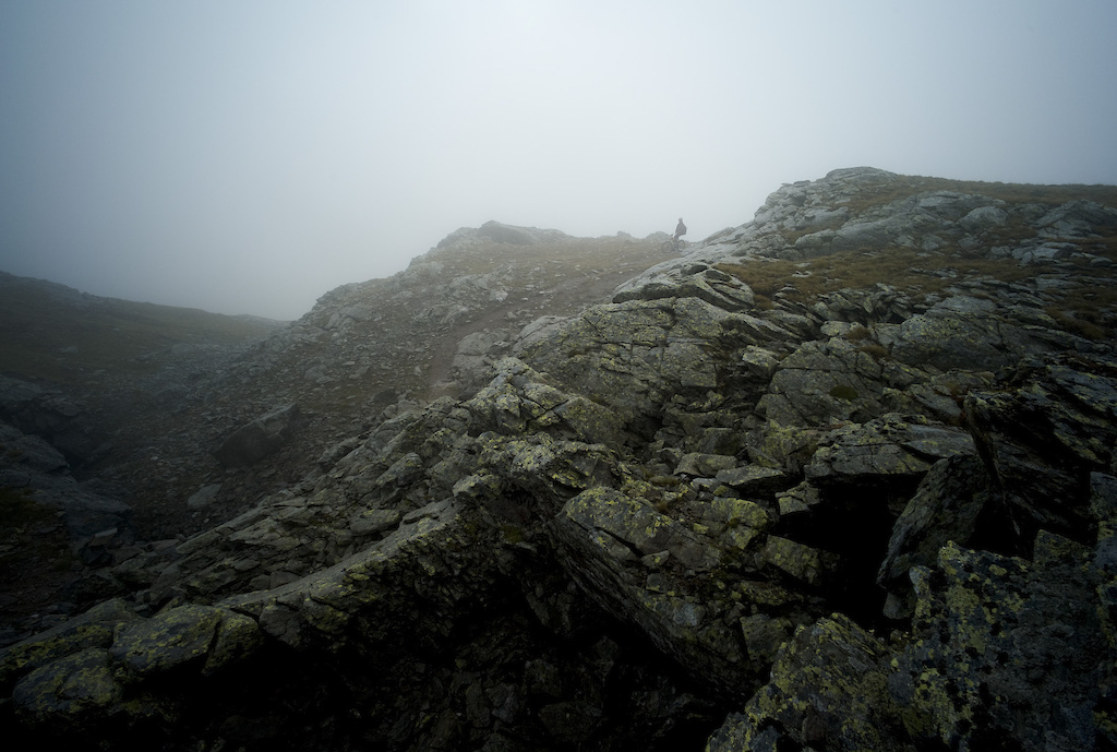 <span style='font-size:12px'>Our return to the Bernina pass was greeted with rain. A long slow steady climb up to the La Stretta pass border with Italy once more, ended in a swirl of cloud, obscuring our descent to Livigno. Just as well, it was steep and scary as hell, but rideable, spitting us out with the kind of massive grins and overdose of endorphins to freewheel into town.</span><br><br>Reaching the hamlet of Lungacqua at 6200 ft is one such error having climbed six hundred feet too much. 'Extra up means extra down though' I repeat mantra-style, as we drop onto a techie trail strewn with canon ball sized rocks before, heading along what is perhaps the best trail we encounter of the trip: a four kilometre stretch of undulating mossy singletrack, that clings to the side of the mountain like it's the material incarnation of the contour line itself. A few spots of rain entice us to quicken the pace, and I dig deep within my energy to stay focused on the half meter wide snaking trail, determined not to pitch myself off the edge. Fifteen minutes of rhythmically swooping trail bliss restores our faith in the bike as a ticket to adventure and it's with tired legs but a sense of accomplishment that we spin up to the door of the convent in Poschiavo for a meal of nuns' home cooking followed by deep, deep sleep.