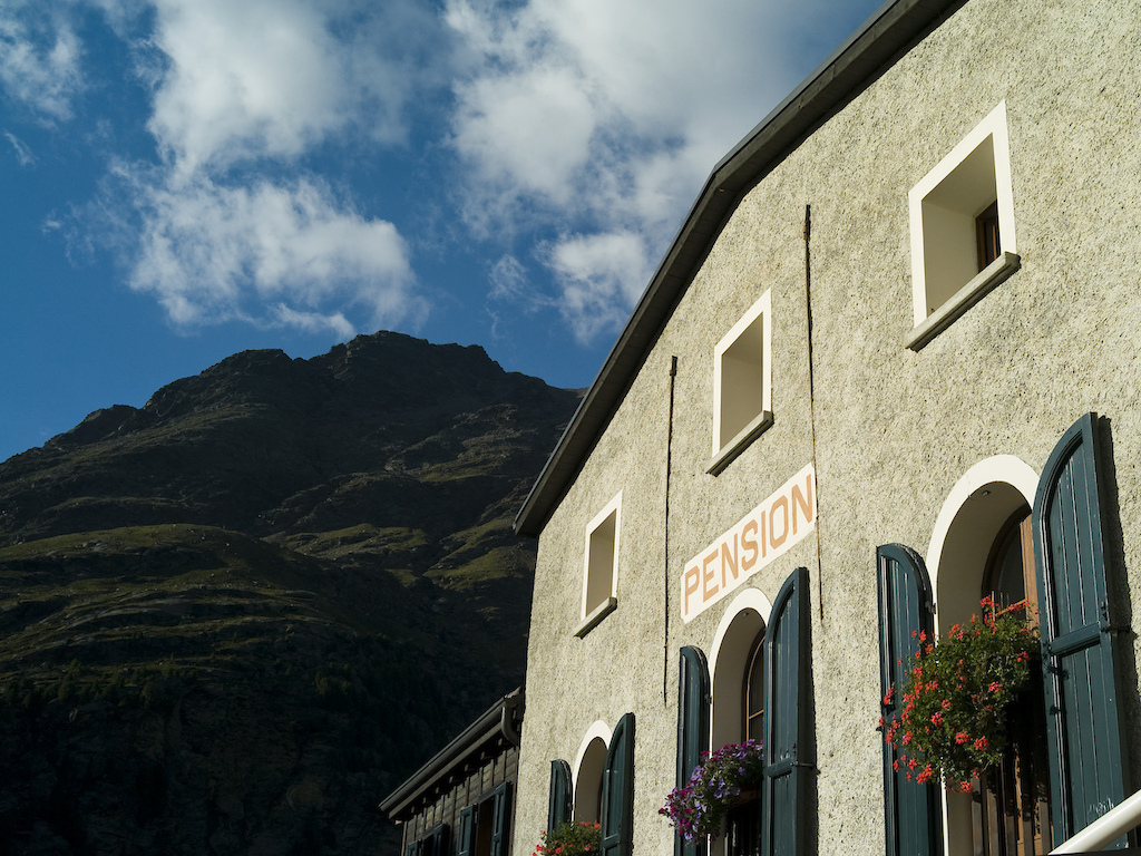 <span style='font-size:12px'>Accommodation en route is comfortable and warm and laden with Italian hospitality. The Forni refuge is just one such beauty.</span><br><br>We wake to sunshine and I instantly regret not planning in a backpack-less day of blasting Livigno's bike park trails. Instead we don our packs and take the Mottolino lift up to 9500 ft to start another day of epic backcountry riding to Santa Catalina. Following the rain, the August sun returns with a vengeance and we sweat our way up climbs to earn several fast, pedal-free descents before arriving at the Bormio gondola, only to find that the top section is closed for the day. The closure leaves us a thousand metres short of the 9000 ft summit from where it would have been a long descent to Santa Catarina. 'It's OK' says the friendly liftie, recognising angst on our weathered faces 'you can just follow the jeep track; it makes a traverse to Santa Catarina'. 