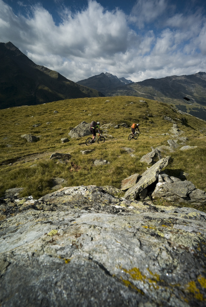 <span style='font-size:12px'>The AR isn't all singletrack, but when it comes it's as good as it gets. Big climbs and big descents in big mountains are about as far from the daily grind as you can get. Ahead of us now is a 1600m descent to finish four days of epic adventure.</span><br><br>A half hour later we are raising looks of concern from occasional mushroom gatherers that we pass as we push our bikes up an impossibly steep climb that will, we insist pop out somewhere. We emerge at a deserted hamlet far above the valley floor along which we should by now be pedaling to our train. We're miles from where we should be at this stage in the game, but the experience seems highlight the inadequacies of the term 