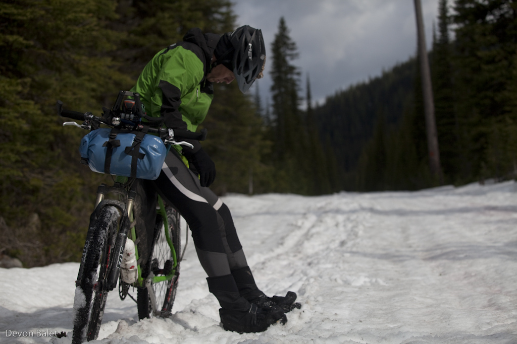 A rider takes a breather mid way through Stryker Pass 11 miles of snow.