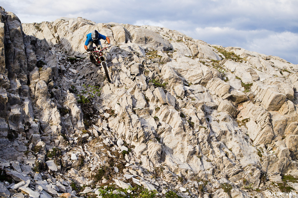The jagged rocks surrounding Money Shot one of Whitehorse s best DH trails make for some interesting line choices. Dan Barham photo - www.danbarham.com