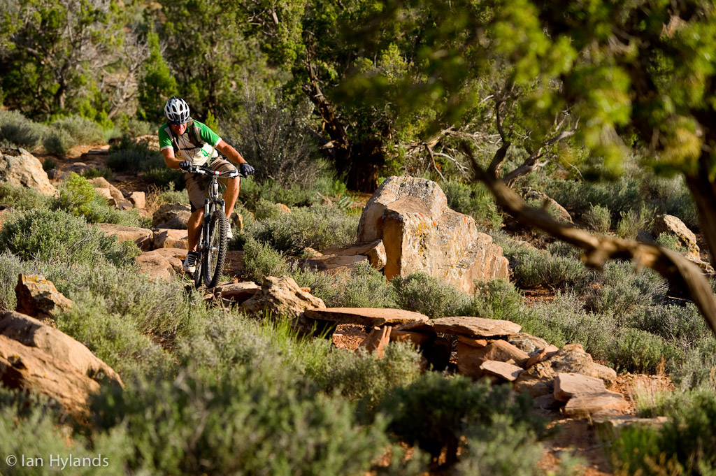 Our guide Bill riding the rock skinny on Grafton Mesa in Utah.