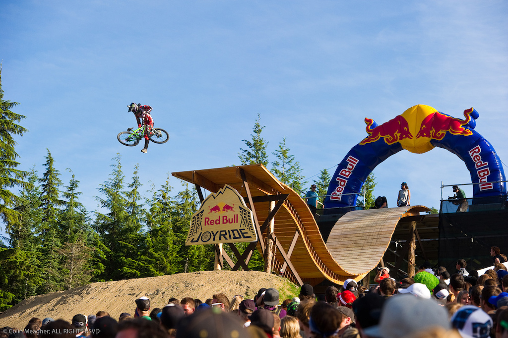 Mike Montgomery sending it at Crankworx. Every contender sent it off this drop but for this shot I opted to go for the crowd s perspective. Mike s the only rider I shot from this spot and while I really should have placed more of the crowd in the foreground to balance the subject I think that overall the shot works well. I just wish I had perhaps shot a few more riders from this vantage point. Next year...