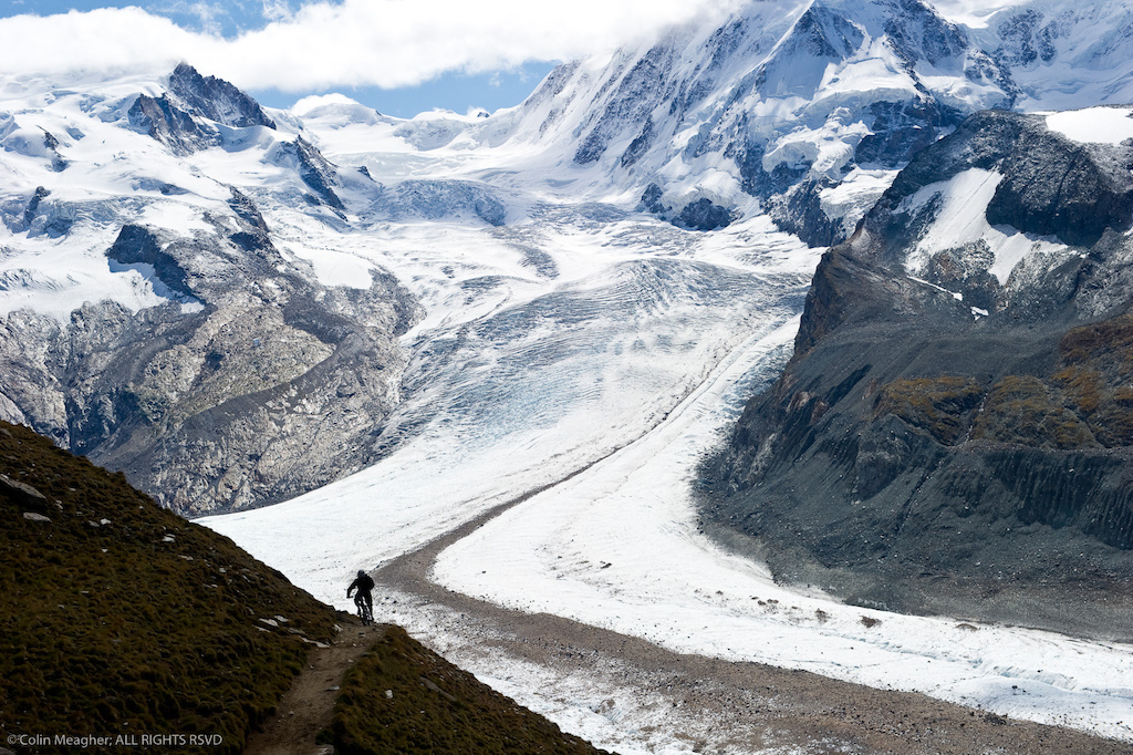 I was lucky enough to sign onto a week with Big Mountain Tours with Stephen Matthews and Seb Kemp as Guides in Verbier and Zermatt. The mountains in Zermatt were really socked in during our first two days there but the clouds blew out and gave us the views that Zermatt is known for on the last day. Here client rider Peter Classen of North Vancouver was kind enough to crank out a lap for the camera with a background that to this day blows my mind.